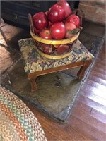 Stool with basket of apples