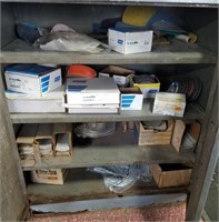Contents of metal cabinet including sand paper