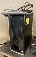 Dell Inspiron computer tower with keyboard