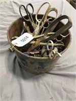 Metal bucket of old scissors