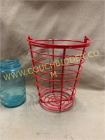 Red metal egg gathering basket