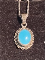 Vintage turquoise pendant on a silver chain.