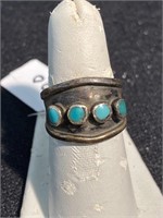 Vintage silver ring with turquoise stones. It has