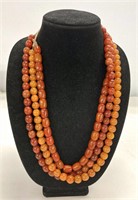 3 STRANDS AMBER COLORED BEADS