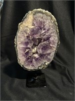 Beautiful amethyst polished display piece on a