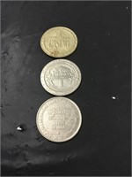 Three vintage casino tokens