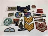 QTY OF ASSORTED CLOTH AND METAL MILITARY BADGES