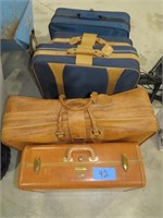 5 assorted luggage pieces