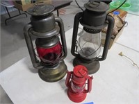 3 kerosene lanterns (1 w/ red globe)