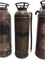 Three antique fire extinguishers