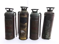 Four antique fire extinguishers