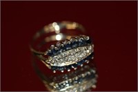 14 K white gold ladies diamond and sapphire ring.