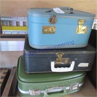 3 small suit cases