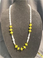 White yellow and black beaded necklace. 16 inch