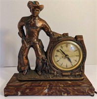 Vintage copper clad electric cowboy clock. Cowboy