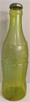 Vintage green Coca-Cola change bank. Measures 24"