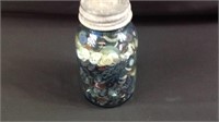 Blue ball jar full of vintage buttons