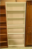 Lot #2917 - Pair of white bookcases. Each