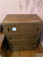 wooden dresser with some wear to top