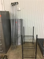 Two metal shelving units one on casters