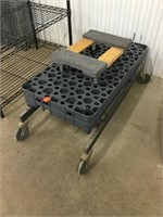 Two four-wheel rolling carts and pair of plastic