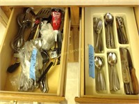 2 drawers full of silverware and knives