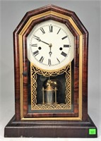 Shaped Top Clock, rosewood case has gold trim ,