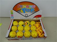 Display of 12 Emoji Spinning Tops