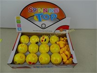 Display of 12 Emoji Spinning Tops