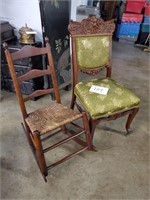 two chairs one in green fabric