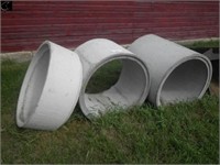 3 Various sized cement sewer manhole sections