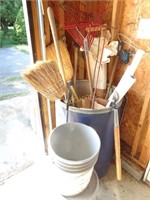 Brooms, rake, laupers, contents of corner in