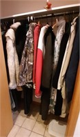 Contents of closet. Men's and women's coats,
