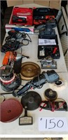 table full of power tools & meters