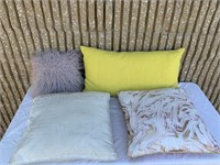 Assorted pillows and couch cushions