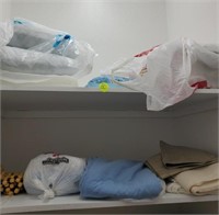 TOP 2 SHELVES OF SHEETS/ BLANKETS AND PILLOWS