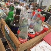 Wood crate with assorted bottles and cans