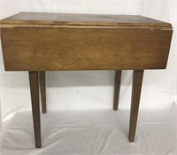 Small drop leaf table measuring 24" x 24" x 23“