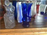 Flower vases & candelabra's on bottom shelf