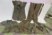 Assortment of military belts and clothing.