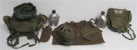 Assortment of military field gear and canteens.
