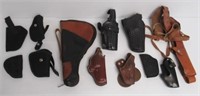 Assortment of canvas and leather gun holster and