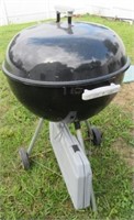 Weber Charcoal Grill with Utensils.