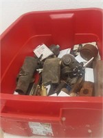 Tote of parts and brass