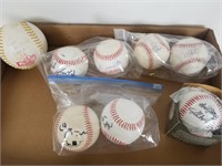 7 autographed baseballs and 1 softball