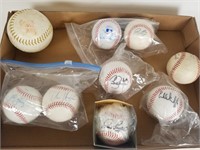 8 autographed baseballs and 1 softball
8 hand
