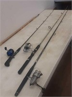 3 fishing poles and reels