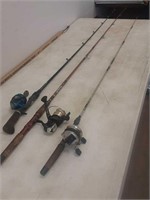 3 fishing poles and reels