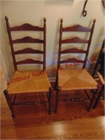 2 wood chairs w/ wicker style seats