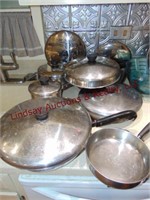 Approx 14 pcs of Revere Ware pots & pans w/ lids